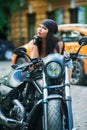 Biker girl motorcycle in the city Royalty Free Stock Photo