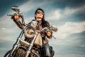 Biker girl on a motorcycle Royalty Free Stock Photo