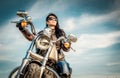 Biker girl on a motorcycle Royalty Free Stock Photo