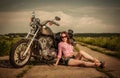 Biker girl and motorcycle Royalty Free Stock Photo