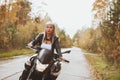 Biker girl rides a motorcycle in the rain. First-person view Royalty Free Stock Photo