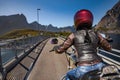 Biker girl rides on road in Norway