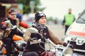 Biker girl riding on the street at the head of the column Royalty Free Stock Photo