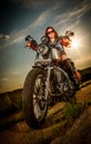 Biker girl sitting on motorcycle