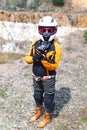 Biker girl wearing a motorcycle outfit, protective clothing, equipment, adventure tourist. outdoor travel, active traveler and red