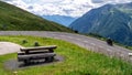 Biker on Grossglockner High Alpine Road, scenic tourist route in Austrian Alps Royalty Free Stock Photo