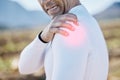 Biker, hand or man with shoulder pain, injury or inflammation outdoors with torn muscle, strain or bruise. Cyclist Royalty Free Stock Photo