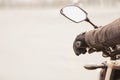 Biker hand rests on the steering wheel motorcycle. Closeup view Royalty Free Stock Photo