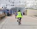 Biker with high visibility vest under Telscombe Cliffs