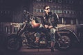 Biker and his bobber style motorcycle