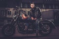 Biker and his bobber style motorcycle