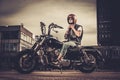 Biker and his bobber style motorcycle