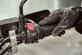 Biker holds onto throttle handle of a motorcycle. Close up shot