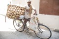 Biker! Local biker using his bike for transportation. Stone Town, Zanzibar. Tanzania Royalty Free Stock Photo