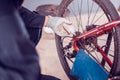 Biker lubricating oil for bicycle chains, Close-up Royalty Free Stock Photo