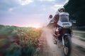 Biker Man Riding on Adventure Motorcycle, summer sunset, sun rise, off road travel concept, enduro rider, freedom and active Royalty Free Stock Photo