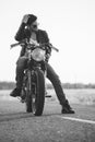 Biker man sits on a bike Royalty Free Stock Photo