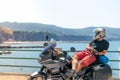 Biker man take a rest with his touristic motorcycle. Happy to arrive at your destination. Sunny Beach Italy. Travel and vacation, Royalty Free Stock Photo