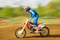 Biker on motocross in motion Royalty Free Stock Photo