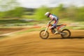 Biker on motocross in motion Royalty Free Stock Photo