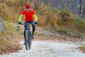 Biker in mountain dirt road Royalty Free Stock Photo
