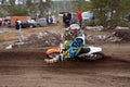 Biker performs a left turn on deep sandy ruts