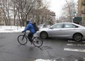 Biker rides along Bronx community in winter snow season