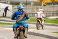 Man riding a motocross in a protective suit