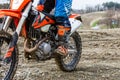 Man riding a motocross in a protective suit