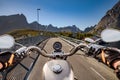 Biker rides on road in Norway. First-person view