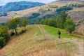 Biker rides on rural road in summer