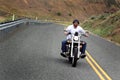 Biker Rides Yellow Line