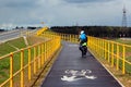 A biker riding on Green Velo bicycle route, the longest consistently marked cycle trail in Eastern Poland