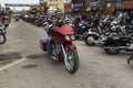 A biker riding his chopper motorcycle during the annual Sturgis Motorcycle rally in the main street of the city of Sturgis Royalty Free Stock Photo