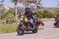 Biker riding italian motorbike Ducati Scrambler