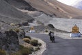 Biker Riding motorcycle on a winding road