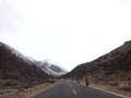 Biker road snow mountain Royalty Free Stock Photo