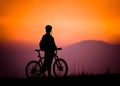biker silhouette watching the sunset