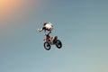 Biker stuntman doing a stunt in the air Royalty Free Stock Photo