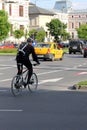 Biker in traffic in Bucharest, Romania