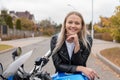 Biker young woman sitting on motorcycle. Outdoor lifestyle portrait Royalty Free Stock Photo