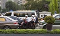 Bikers and cars waiting in traffic in Manila, Makati, Philippines