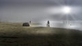 Bikers in Dense Fog biking on the Beach in Cox Bay at the Pacific Rim National Park Royalty Free Stock Photo