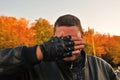 Bikers Festival in Moscow. Portrait of a man biker. He closes his face with a hand for fun. Royalty Free Stock Photo