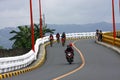 Bikers and motorcycle riders cross the Tumana Bridge in Marikina City. Royalty Free Stock Photo