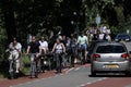 Bikers ride on bycicle lane in Aalsmeer, Netherlands Royalty Free Stock Photo