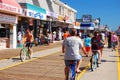 Bikers ride on a crowded boardwalk in Wildwood, New Jersey