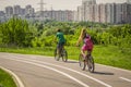 Bikers ride on the road in the park/ Russia, Moscow, 05/18/2014