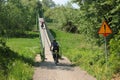 Bikers riding on a footbridge over San river in Eastern Poland Royalty Free Stock Photo