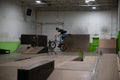 Bikers and skaters are practicing their tricks inside Royalty Free Stock Photo